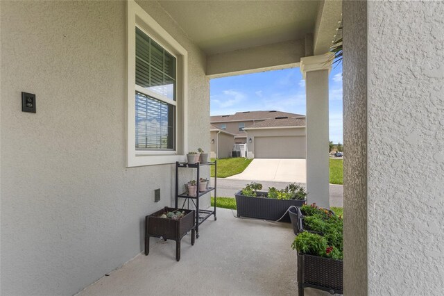 15096 Chapter Way, Winter Garden, FL 34787 - view of patio with a garage and driveway