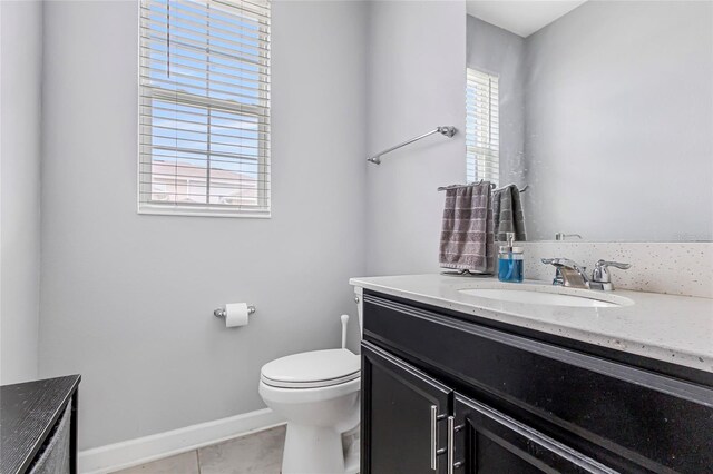 15096 Chapter Way, Winter Garden, FL 34787 - bathroom featuring vanity, toilet, baseboards, and tile patterned floors