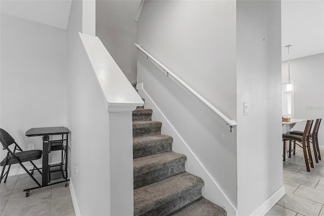 15096 Chapter Way, Winter Garden, FL 34787 - stairs with tile patterned flooring, baseboards, and a towering ceiling