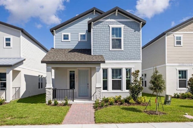 14111 Frasier St, Winter Garden, FL 34787 - craftsman-style house featuring covered porch, a front lawn, and roof with shingles