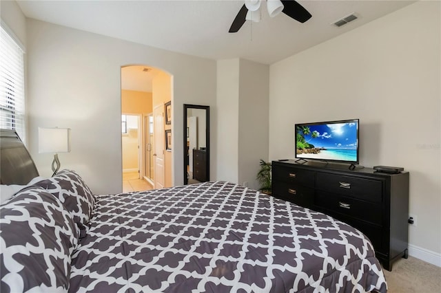 8219 Roseville Blvd, Davenport, FL 33896 - bedroom featuring arched walkways, baseboards, and a ceiling fan