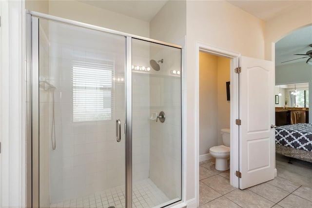 8219 Roseville Blvd, Davenport, FL 33896 - full bath with toilet, ceiling fan, a shower stall, and tile patterned flooring