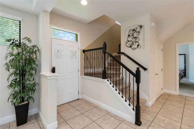 8219 Roseville Blvd, Davenport, FL 33896 - foyer entrance with light tile patterned floors, baseboards, recessed lighting, and stairs
