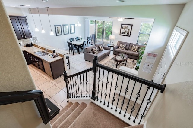 8219 Roseville Blvd, Davenport, FL 33896 - stairway with tile patterned flooring and a ceiling fan