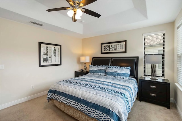 8219 Roseville Blvd, Davenport, FL 33896 - carpeted bedroom featuring baseboards, a raised ceiling, and a ceiling fan