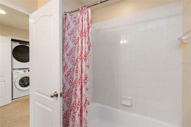 8219 Roseville Blvd, Davenport, FL 33896 - full bathroom with stacked washer and clothes dryer and shower / bath combo with shower curtain