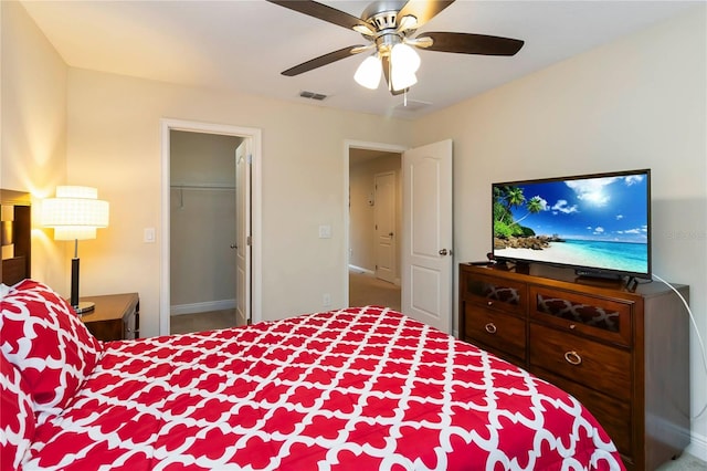 8219 Roseville Blvd, Davenport, FL 33896 - bedroom featuring a ceiling fan, baseboards, a walk in closet, and carpet floors