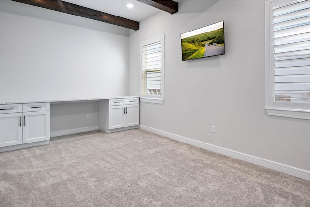 13323 Panama Beach Ct, Orlando, FL 32827 - spare room featuring beamed ceiling, light carpet, and baseboards