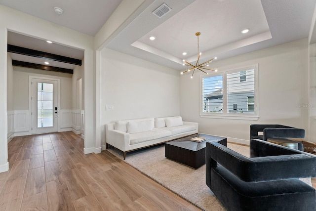 13323 Panama Beach Ct, Orlando, FL 32827 - living area featuring a chandelier, light wood-style flooring, healthy amount of natural light, recessed lighting, and a tray ceiling