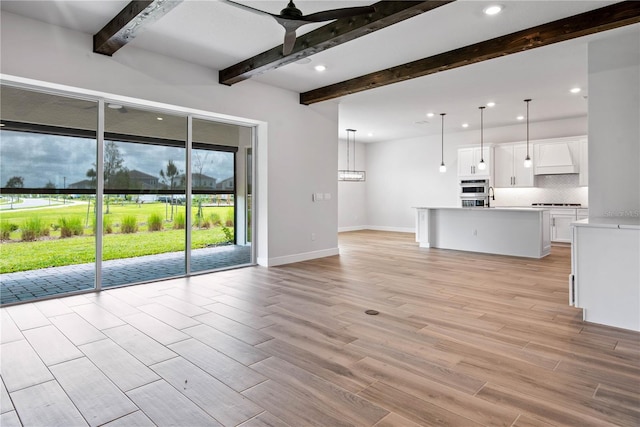 13323 Panama Beach Ct, Orlando, FL 32827 - unfurnished living room with a ceiling fan, light wood finished floors, beamed ceiling, recessed lighting, and baseboards
