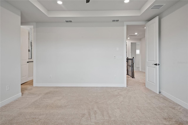 13323 Panama Beach Ct, Orlando, FL 32827 - unfurnished room featuring a raised ceiling, light carpet, recessed lighting, and baseboards