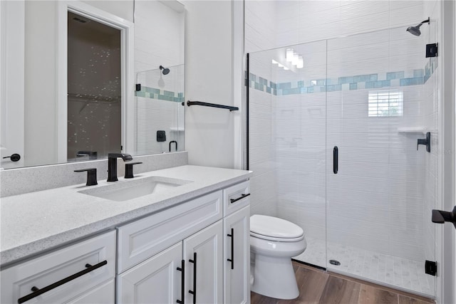 13323 Panama Beach Ct, Orlando, FL 32827 - full bath featuring toilet, vanity, a stall shower, and wood finished floors