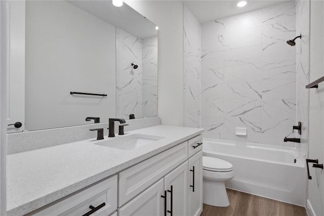 13323 Panama Beach Ct, Orlando, FL 32827 - bathroom with vanity, toilet, wood finished floors, bathing tub / shower combination, and recessed lighting