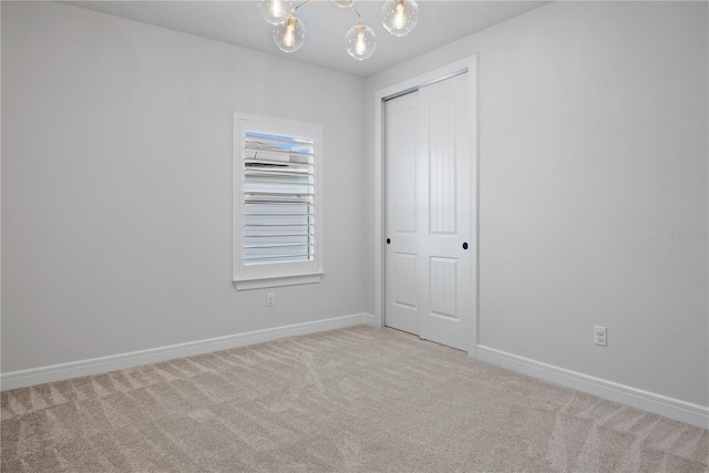 13323 Panama Beach Ct, Orlando, FL 32827 - carpeted spare room with baseboards and a chandelier