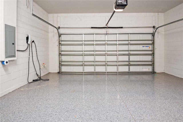13323 Panama Beach Ct, Orlando, FL 32827 - garage with electric panel, concrete block wall, and a garage door opener