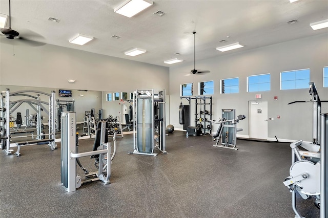 13323 Panama Beach Ct, Orlando, FL 32827 - gym with a ceiling fan and a towering ceiling