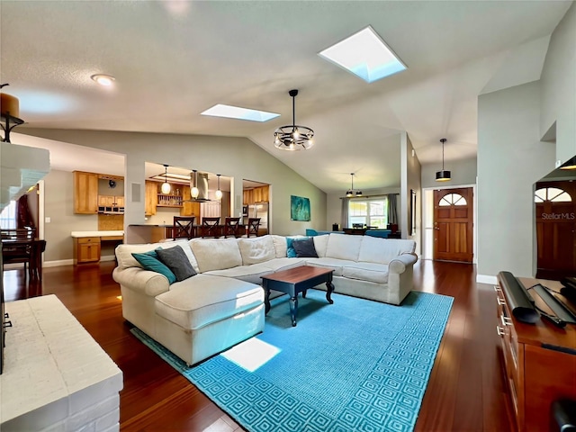5724 Pitch Pine Dr, Orlando, FL 32819 - living room featuring a skylight, lofted ceiling, and dark wood-style flooring