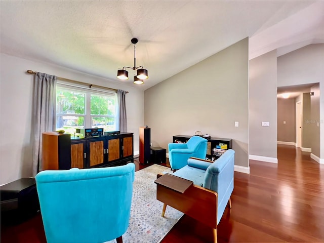 5724 Pitch Pine Dr, Orlando, FL 32819 - living area with a chandelier, vaulted ceiling, and wood finished floors