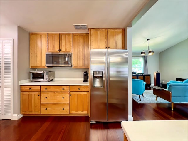 5724 Pitch Pine Dr, Orlando, FL 32819 - kitchen featuring appliances with stainless steel finishes, dark wood-type flooring, and light countertops