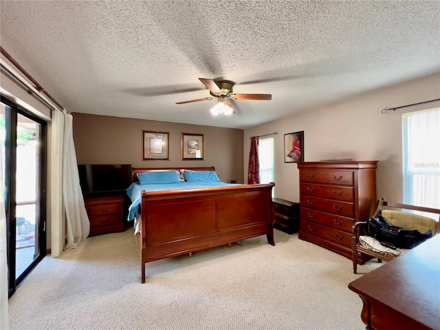 5724 Pitch Pine Dr, Orlando, FL 32819 - bedroom featuring access to exterior, light colored carpet, a textured ceiling, and a ceiling fan