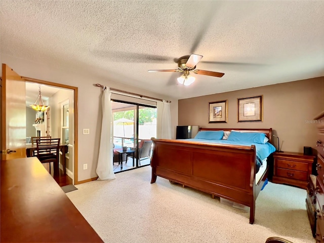5724 Pitch Pine Dr, Orlando, FL 32819 - bedroom featuring access to outside, light carpet, a textured ceiling, and ceiling fan