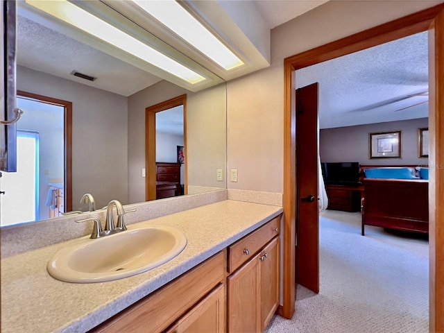 5724 Pitch Pine Dr, Orlando, FL 32819 - bathroom featuring vanity and a textured ceiling