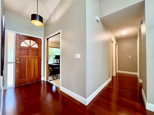 5724 Pitch Pine Dr, Orlando, FL 32819 - foyer entrance featuring wood-type flooring and high vaulted ceiling