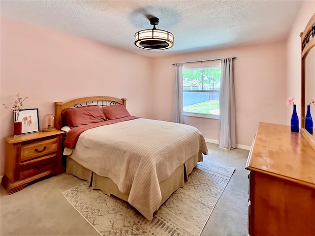 5724 Pitch Pine Dr, Orlando, FL 32819 - bedroom featuring a textured ceiling and light colored carpet