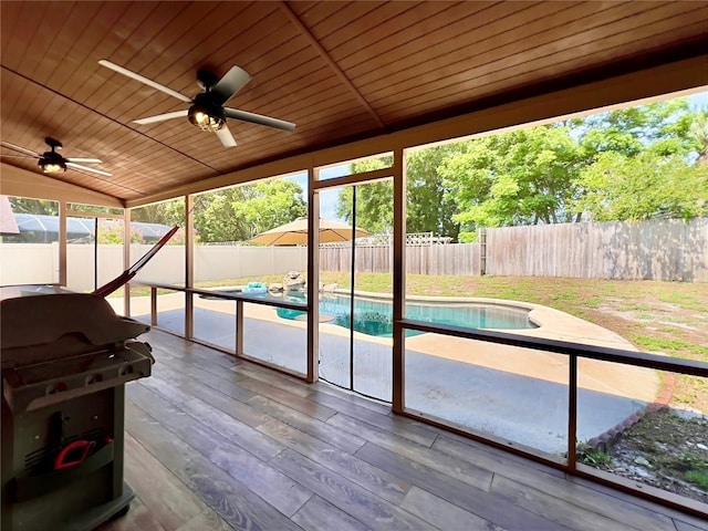 5724 Pitch Pine Dr, Orlando, FL 32819 - unfurnished sunroom featuring lofted ceiling, a ceiling fan, and plenty of natural light