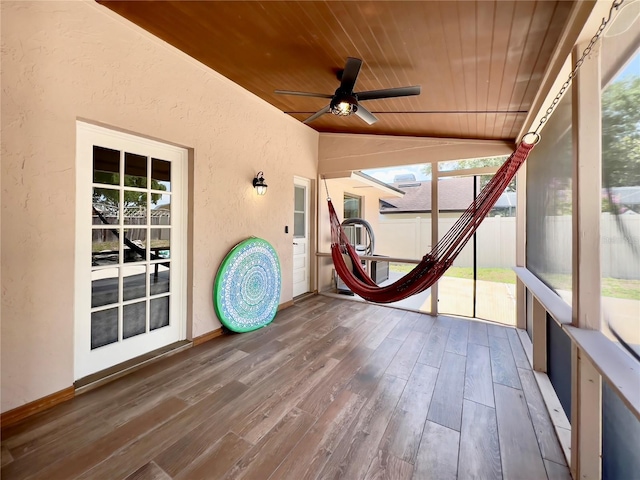 5724 Pitch Pine Dr, Orlando, FL 32819 - unfurnished sunroom featuring wooden ceiling, a textured wall, ceiling fan, healthy amount of natural light, and wood finished floors