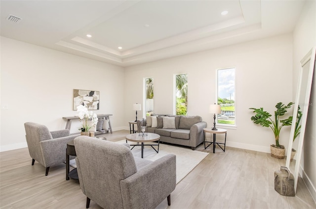 508 Topsail Dr, Rockledge, FL 32955 - living area featuring a raised ceiling, recessed lighting, and light wood-style flooring
