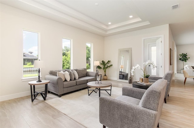 508 Topsail Dr, Rockledge, FL 32955 - living room featuring light wood-style flooring, a tray ceiling, and recessed lighting