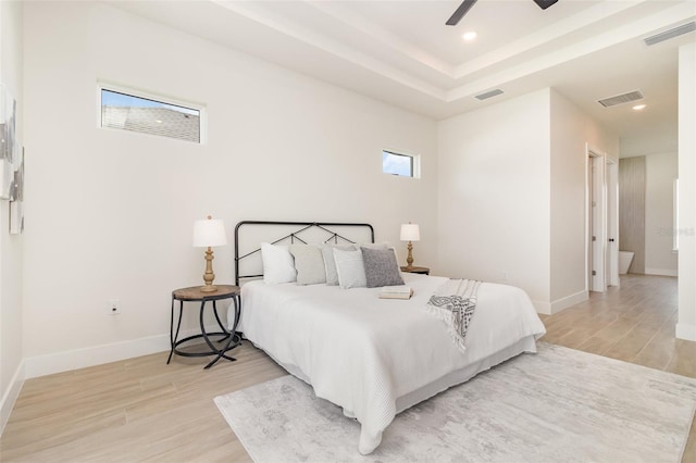 508 Topsail Dr, Rockledge, FL 32955 - bedroom featuring light wood-style flooring, recessed lighting, a raised ceiling, and a ceiling fan