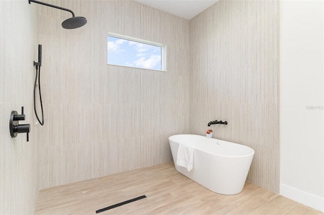 508 Topsail Dr, Rockledge, FL 32955 - bathroom with a tile shower and a freestanding bath