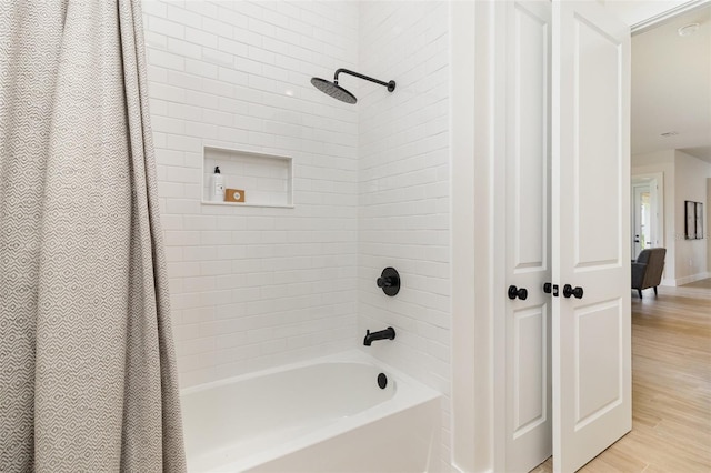 508 Topsail Dr, Rockledge, FL 32955 - bathroom featuring shower / tub combo and wood finished floors