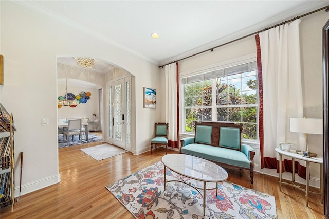 1420 Palmer Ave, Winter Park, FL 32789 - living area with arched walkways, crown molding, light wood-style flooring, baseboards, and recessed lighting