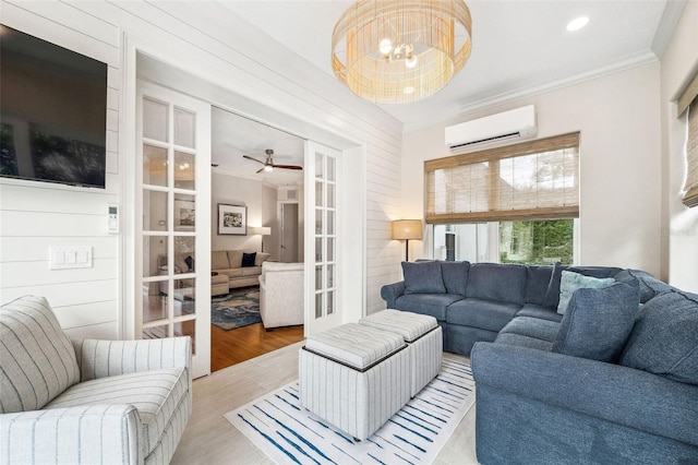 1420 Palmer Ave, Winter Park, FL 32789 - living area with a wall mounted air conditioner, ornamental molding, light wood-style floors, a chandelier, and french doors