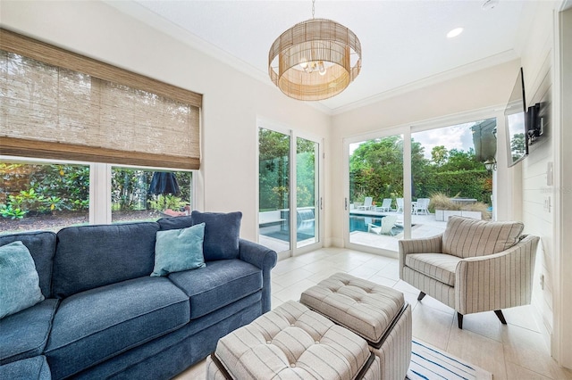 1420 Palmer Ave, Winter Park, FL 32789 - living area with ornamental molding, light tile patterned floors, and a chandelier