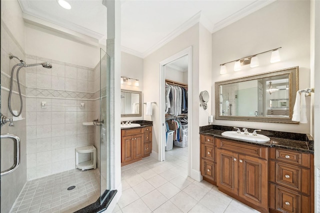 1420 Palmer Ave, Winter Park, FL 32789 - full bathroom featuring a shower stall, ornamental molding, tile patterned floors, vanity, and a spacious closet