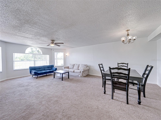 2729 N Poinciana Blvd Unit 125, Kissimmee, FL 34746 - dining area featuring ceiling fan, carpet floors, a chandelier, and a textured ceiling
