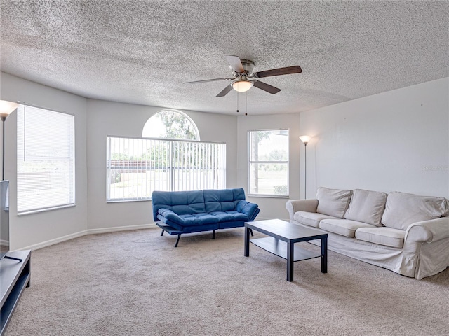 2729 N Poinciana Blvd Unit 125, Kissimmee, FL 34746 - carpeted living area with ceiling fan, a textured ceiling, and baseboards