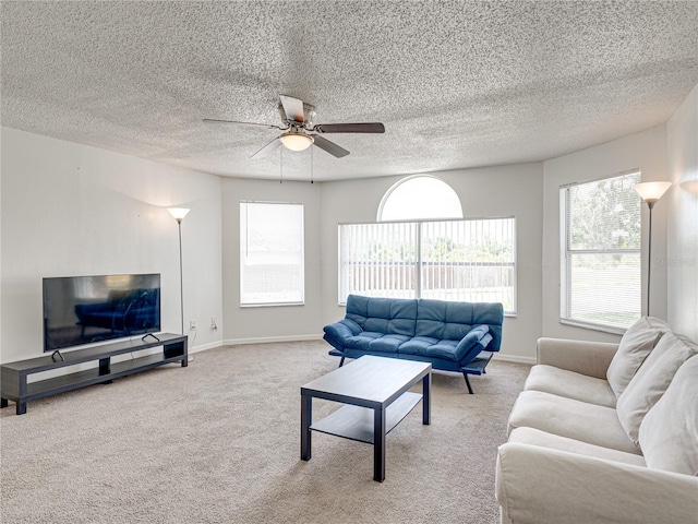 2729 N Poinciana Blvd Unit 125, Kissimmee, FL 34746 - carpeted living room with a ceiling fan, plenty of natural light, baseboards, and a textured ceiling
