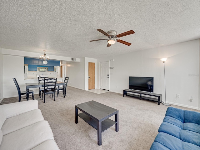 2729 N Poinciana Blvd Unit 125, Kissimmee, FL 34746 - carpeted living area with a chandelier, a ceiling fan, a textured ceiling, and baseboards