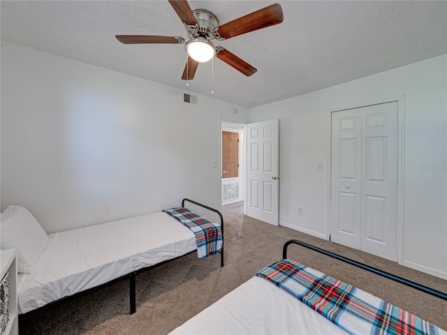 2729 N Poinciana Blvd Unit 125, Kissimmee, FL 34746 - carpeted bedroom with a textured ceiling, baseboards, and ceiling fan