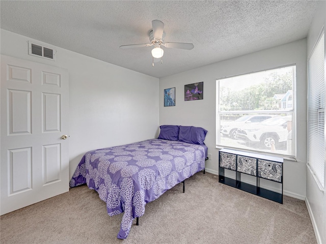2729 N Poinciana Blvd Unit 125, Kissimmee, FL 34746 - carpeted bedroom featuring a textured ceiling and a ceiling fan