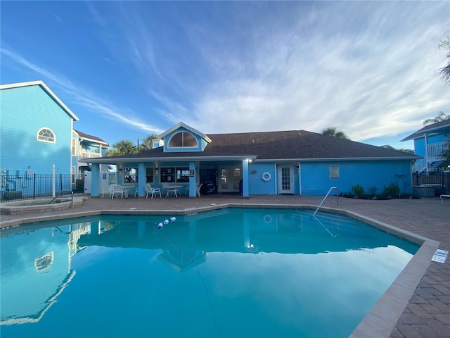 2729 N Poinciana Blvd Unit 125, Kissimmee, FL 34746 - community pool featuring a patio and french doors