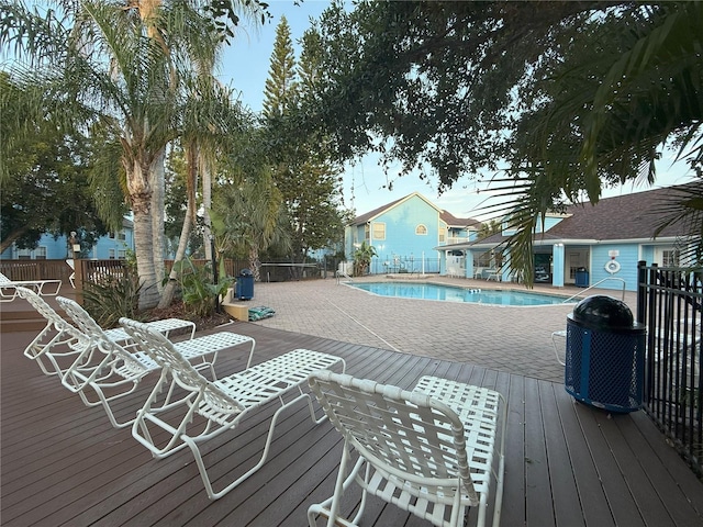 2729 N Poinciana Blvd Unit 125, Kissimmee, FL 34746 - community pool featuring a wooden deck, a patio area, and central AC unit