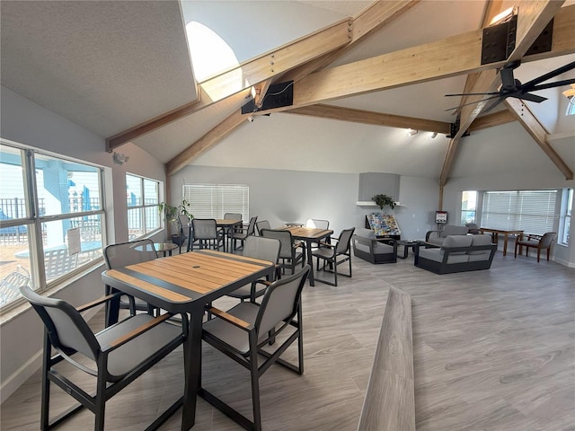 2729 N Poinciana Blvd Unit 125, Kissimmee, FL 34746 - dining room with a ceiling fan, baseboards, plenty of natural light, beam ceiling, and light wood finished floors