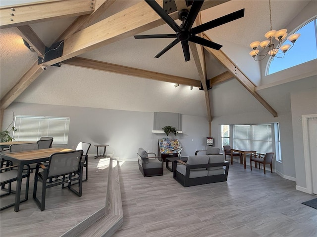 2729 N Poinciana Blvd Unit 125, Kissimmee, FL 34746 - living area with beamed ceiling, a chandelier, high vaulted ceiling, a textured ceiling, and baseboards