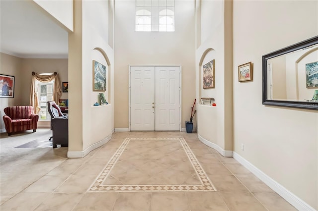 1429 Arbitus Cir, Oviedo, FL 32765 - foyer with a high ceiling, baseboards, and light tile patterned flooring